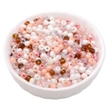 Mixed warm tone glass seed beads in a white ceramic bowl for DIY jewelry making - Amber Sunset