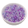Assorted purple glass seed beads and tubes in a ceramic bowl for DIY jewelry making - Grape Purple