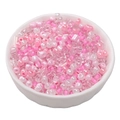 Pink and clear mixed glass seed beads in a ceramic bowl for DIY jewelry making - Cherry Pink