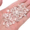 Transparante koffieboon glazen kralen voor DIY sieraden getoond in de handpalm - 10x8mm (20 Stuks/Pak) / Wit