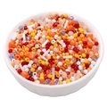 Colorful mixed glass seed beads for DIY jewelry making in a white ceramic bowl - Orange Yellow Mix