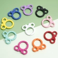 Anillas de resorte con diseño de lazo animado en varios colores vibrantes - Forma de Cabeza de Oso (37x34mm)