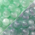 10-12mm Harzperlen mit Sternenglimmer in Hellgrün und Blaugrün für DIY-Schmuckherstellung - Grün