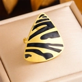 Macro shot of triangle vintage gold ring with black animal patterns on satin box - Triangle Pattern Hollow Style (R467)