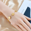 Elegant gold flower bracelet with five-petal charms worn on wrist with silk background - Flower (B1156) / Gold