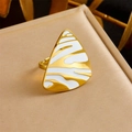 Macro shot of gold-plated ring with triangular white enamel pattern and open band - White Rounded Triangle Enamel Style (R470)