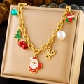 Golden Christmas charm bracelet with Santa, reindeer and pearl details for holiday style - N2937