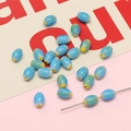 Sky blue oval beads with vertical ribbing and colorful tips for DIY jewelry making - 10 Pieces/Pack (6x9mm, Hole 1mm) / Light Blue