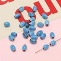 DIY jewelry components featuring oval blue striped millefiori glass beads for handcrafting - 10 Pieces/Pack (6x9mm, Hole 1mm) / Blue