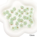 Ciondolo a fiore in resina verde chiaro 13mm con centro dorato per gioielli fai da te - Fiore di Pero Verde Chiaro