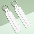 White leather key ring pendant with silver metal ring and neat stitching details - White