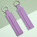 Set of two purple leather strap keychains with silver metal ring and contrast white stitching - Medium Purple
