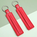 Set of two bright red leather keychains with silver rivets and polished metal rings - Red
