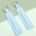 Light blue leather keychain pendant with silver metal ring and fine stitching detail - Light Blue