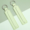 Light green leather strap keychain with metal ring and fine stitching detail - Light Green