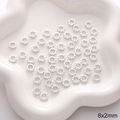 Silver alloy DIY jewelry spacer beads with embossed texture on a white tray, 8x2mm - Textured Flat Round Style 2