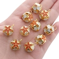Golden flower hollow sphere charms for DIY jewelry making in orange and white enamel - Orange