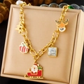 Christmas themed gold link bracelet with Santa Claus, reindeer, and tree charms - N2938