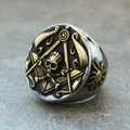 Macro detail of retro stainless steel masonic ring with gold skull and compass carving - US 7 / Gold & Silver