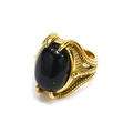 Detailed close-up of punk style ring featuring large black gemstone and eagle claw setting - Gold Black Zirconia