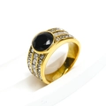 Detailed macro view of a gold titanium ring featuring a black stone and pave zirconia - US 6 / Gold Black