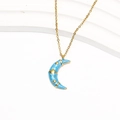 Close-up of 18k gold plated moon pendant with blue marble texture and golden star detail - Gold Blue Enamel