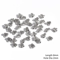 Detailed macro of 8mm vintage silver alloy beads with 2mm holes for jewelry making - Woven Texture Style (BJI1048) / Length 8mm Hole 2mm (20 Pieces/Pack)