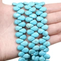 Detailed macro view of synthetic turquoise teardrop beads with brown vein texture - Drilled Water Drop (8x12mm)