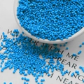 Matte light blue glass seed beads for DIY jewelry making in a white container - 100g/Pack / Dark Blue