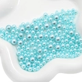 Light blue faux pearls in assorted sizes on a cloud tray for DIY crafts - 3-8mm / Aqua