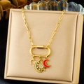 Detail of gold paperclip chain necklace with star, moon pendants and red enamel moon - Star Moon Rhinestone and Red Crescent Style (N3431)