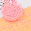 Perline di vetro rosa smerigliato per gioielli fai-da-te in un contenitore di plastica tondo - Rosa coreano