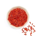 Vibrant orange spiral bugle beads for DIY jewelry and embroidery in a white bowl - 10g/Pack (2x6mm, Approx. 300 Pcs) / Orange Red