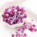 Mixed purple and white ABS faux pearl beads for DIY jewelry making in a ceramic bowl - Dreamy Purple Mix