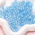 Translucent light blue square acrylic alphabet beads in a white flower shaped dish - Square Blue with White Letters / 100 Pieces/Pack (6x6mm)