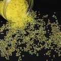 Iridescent yellow glass bubble beads pouring from a container for DIY jewelry making - Diameter 2-2.5mm 450g/Pack / Yellow