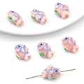 Detailed view of pink handmade fish ceramic beads with glazed finish for DIY jewelry - Blue Striped Fish Style / 2 Pieces/Pack / Pink