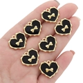 Golden heart pendants with black enamel and bow detail for DIY jewelry making - Heart Pattern Bow / Black & Gold