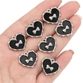 Set of 7 heart charms with black enamel, silver wavy edges, and small silver bows for DIY jewelry - Heart Pattern Bow / Black and Silver