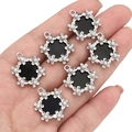 DIY floral alloy charms with black enamel center and white pearls in palm of hand - Round Wreath / Black and Silver