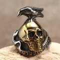 Macro shot of two-tone skull ring featuring a silver raven and Expendable engraving - US 7 / Gold & Silver