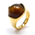 Detailed close-up of a vintage gold titanium ring featuring a brown cat eye stone inlay - Gold Brown Cat's Eye