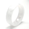 Detail view of white bioceramic ring featuring modern geometric faceted surface design - US 6 / White Ceramic Style 1