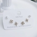Detail of 925 silver post earring set with pearl, flower cross, and starburst studs - Star Moon Cross Pattern