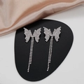 Detailed view of silver butterfly tassel earrings with sparkling white rhinestones - Golden Butterfly Rhinestone Earrings