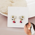 Close-up of S925 silver flower and cherry drop earrings on a soft display card - Tassel Red Fruit Style