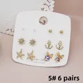 6 paia di orecchini nautici dorati con perle e stelle marine su carta display - Stile 5 (Fiocco Oceano)