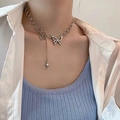 Silver Y2K butterfly necklace with hollow pendant and star drop chain on model - Silver