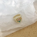 Close-up of vintage gold tulip ring with pink enamel detail on crumpled paper - Tulip Ring