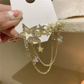 Elegante fermaglio per capelli a stella dorata con strass lucidi e nappe pendenti - Stile Nappina Stella